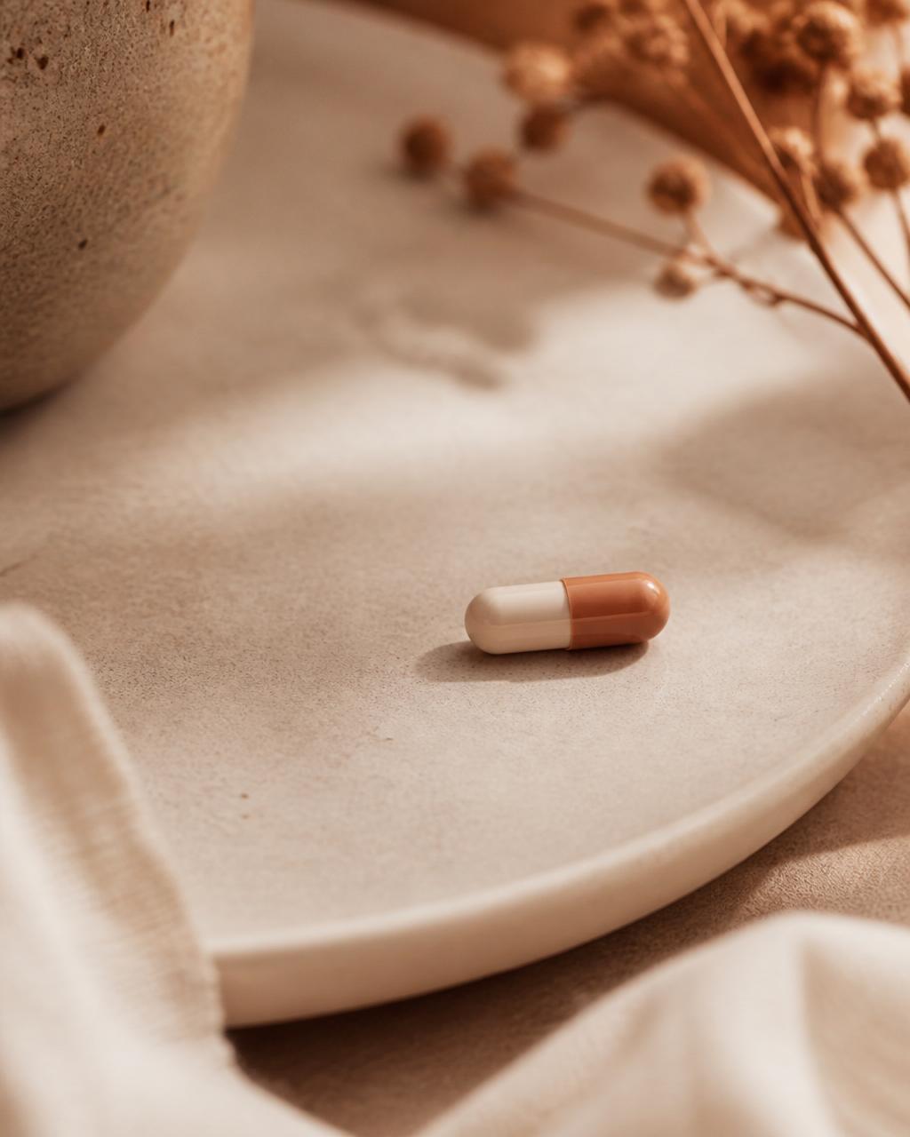 Editorial still life of a single oral medication capsule